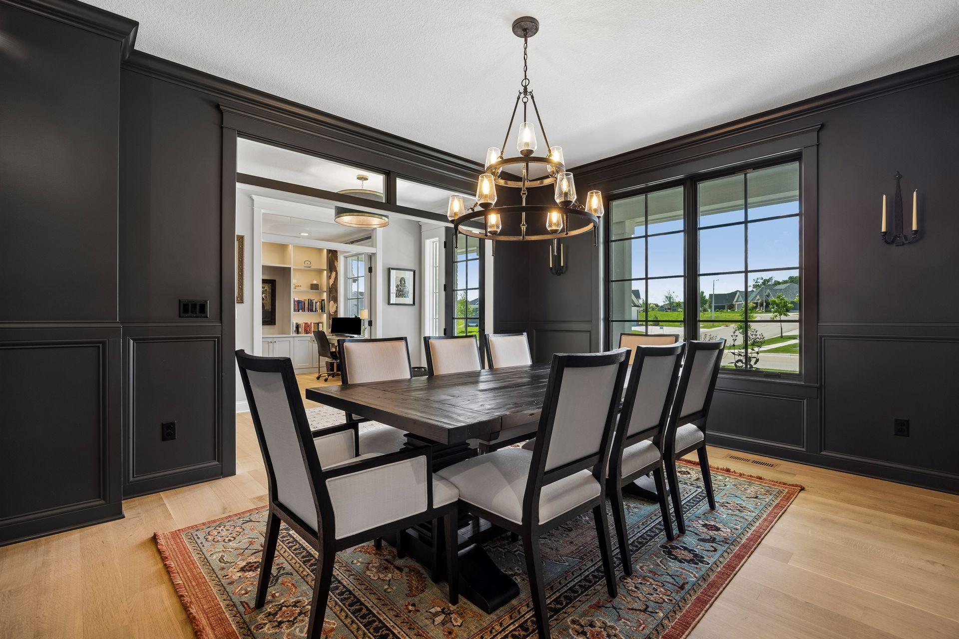Rich architectural detailing, expansive black windows, and timeless finishes elevate every gathering.