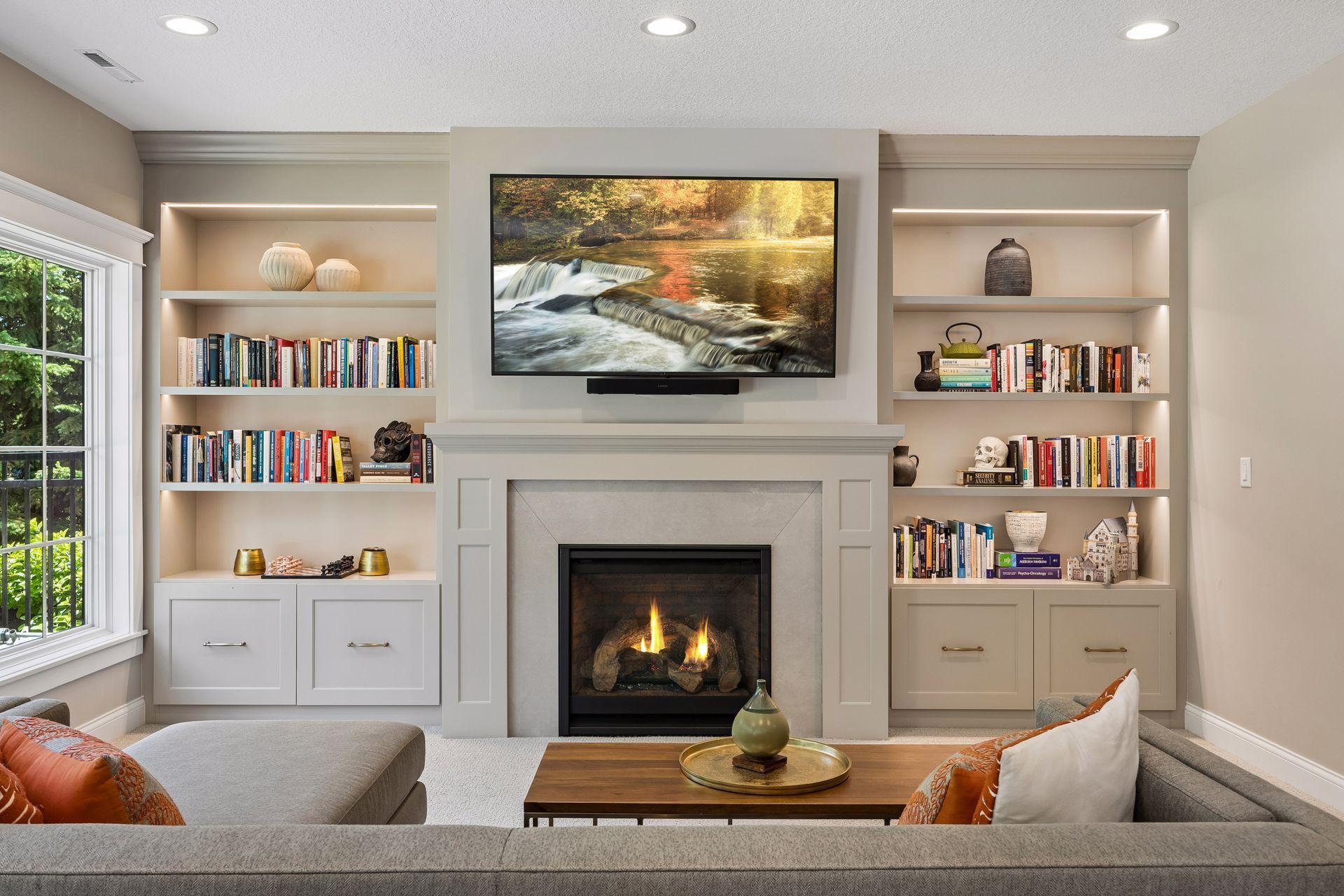 A seamless blend of custom cabinetry, display shelving, and warm gathering spaces defines the heart of the lower level.