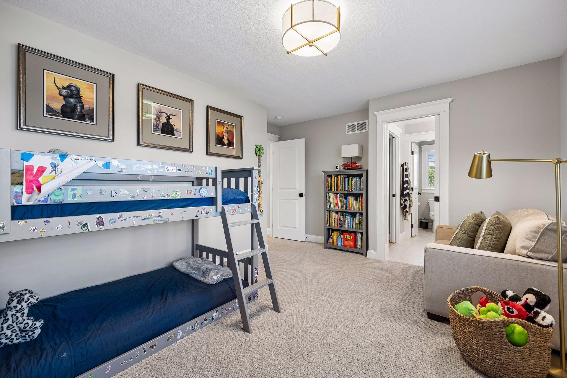 A generously sized bedroom offering warmth, comfort, and beautifully finished spaces for family or guests.