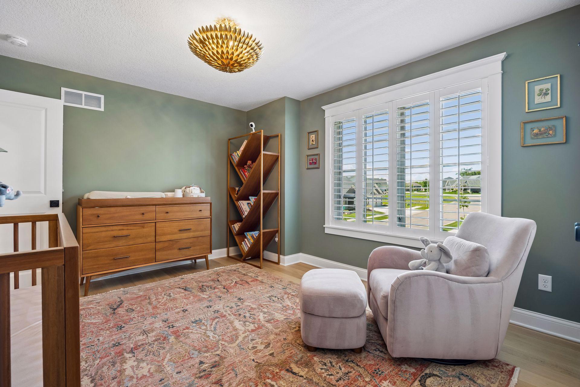 Designer lighting, custom millwork, and calming hues create a room that will gracefully evolve through every stage of life.