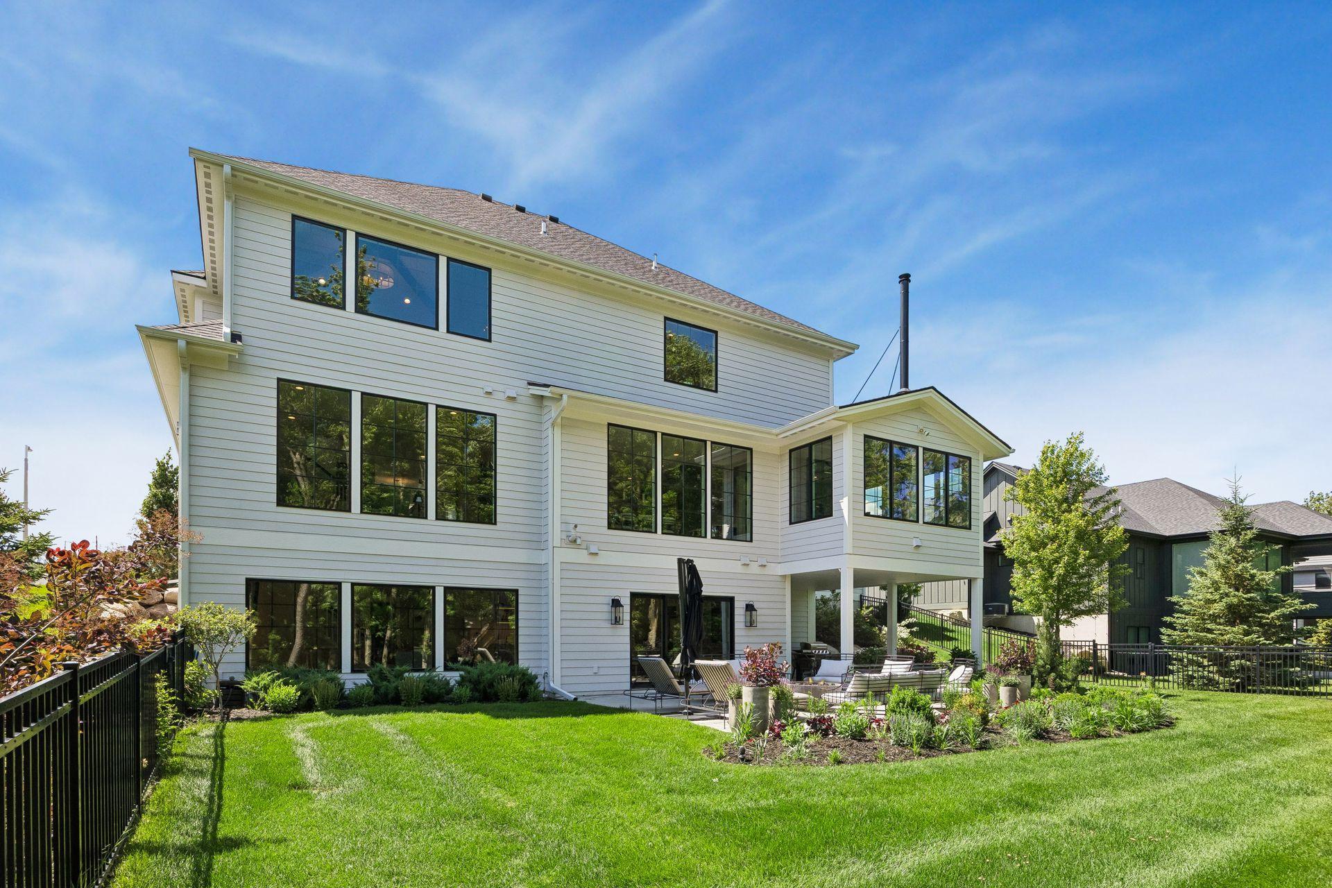 Professionally landscaped grounds create a private backyard oasis designed for entertaining and quiet evenings alike.