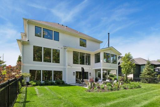 Professionally landscaped grounds create a private backyard oasis designed for entertaining and quiet evenings alike.