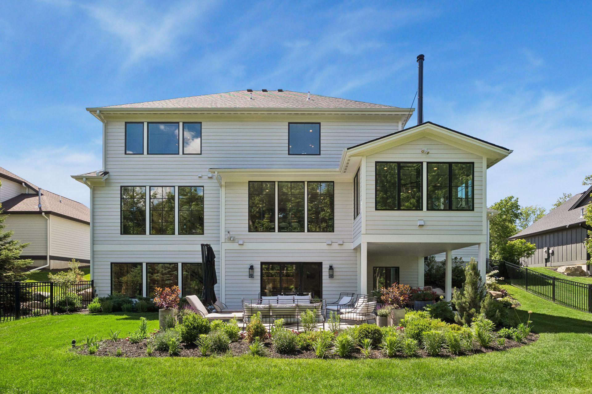 Large expanses of glass flood the home with natural light while capturing peaceful wooded views from nearly every level.