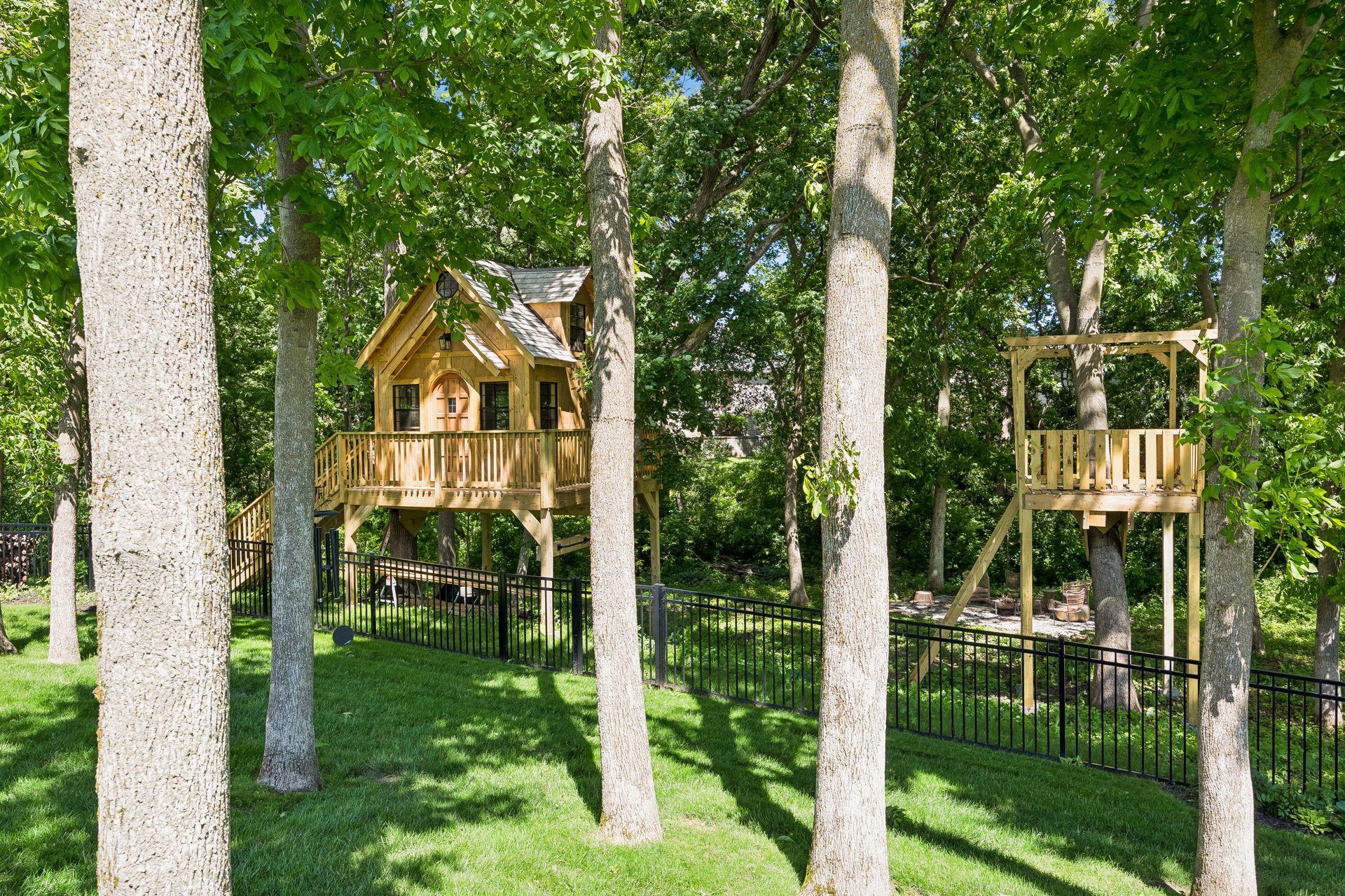 A professionally crafted cedar treehouse creates an unforgettable backyard experience that inspires imagination and adventure.