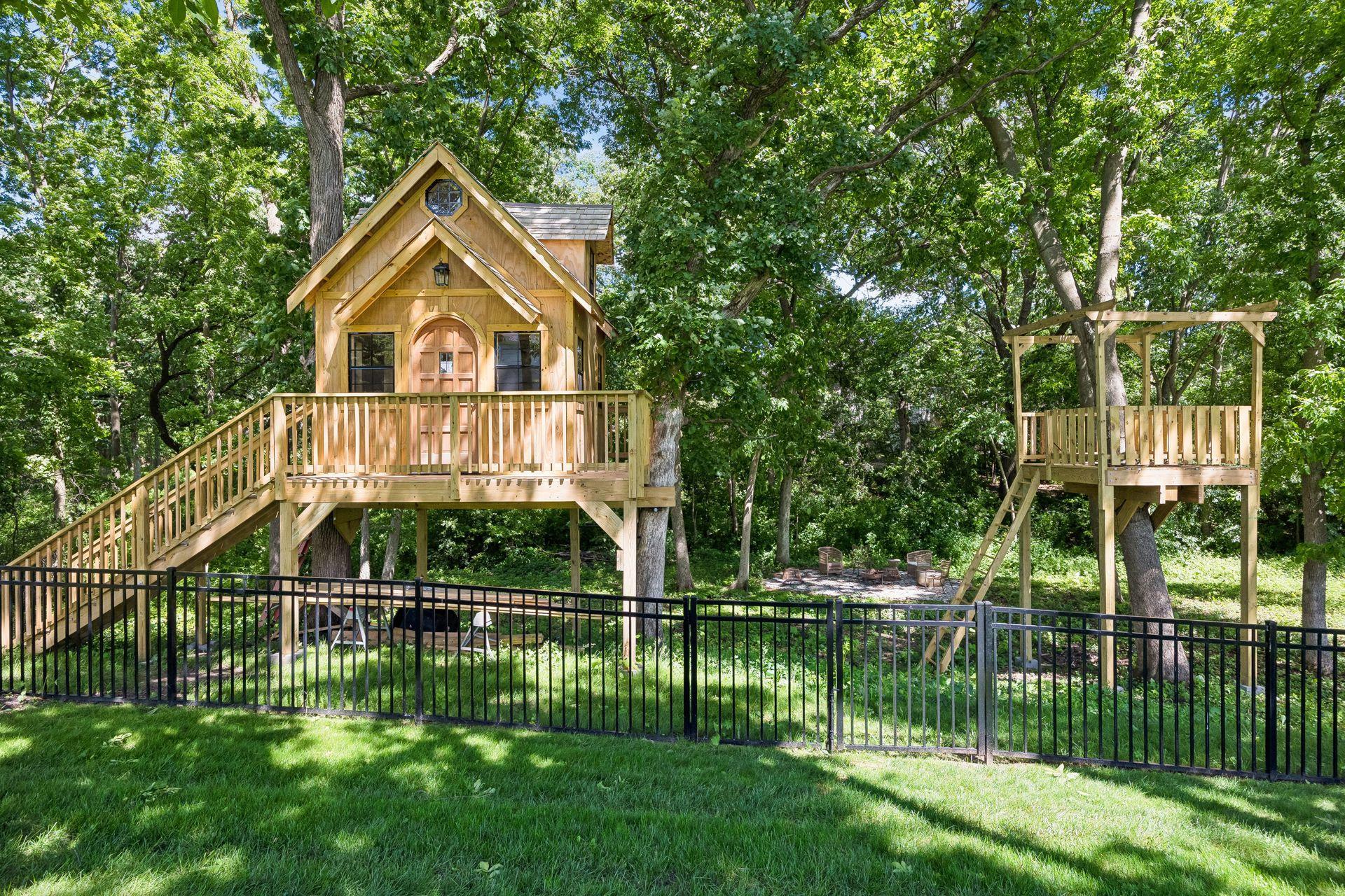 Built among the mature trees, this incredible custom treehouse is every child's dream retreat.
