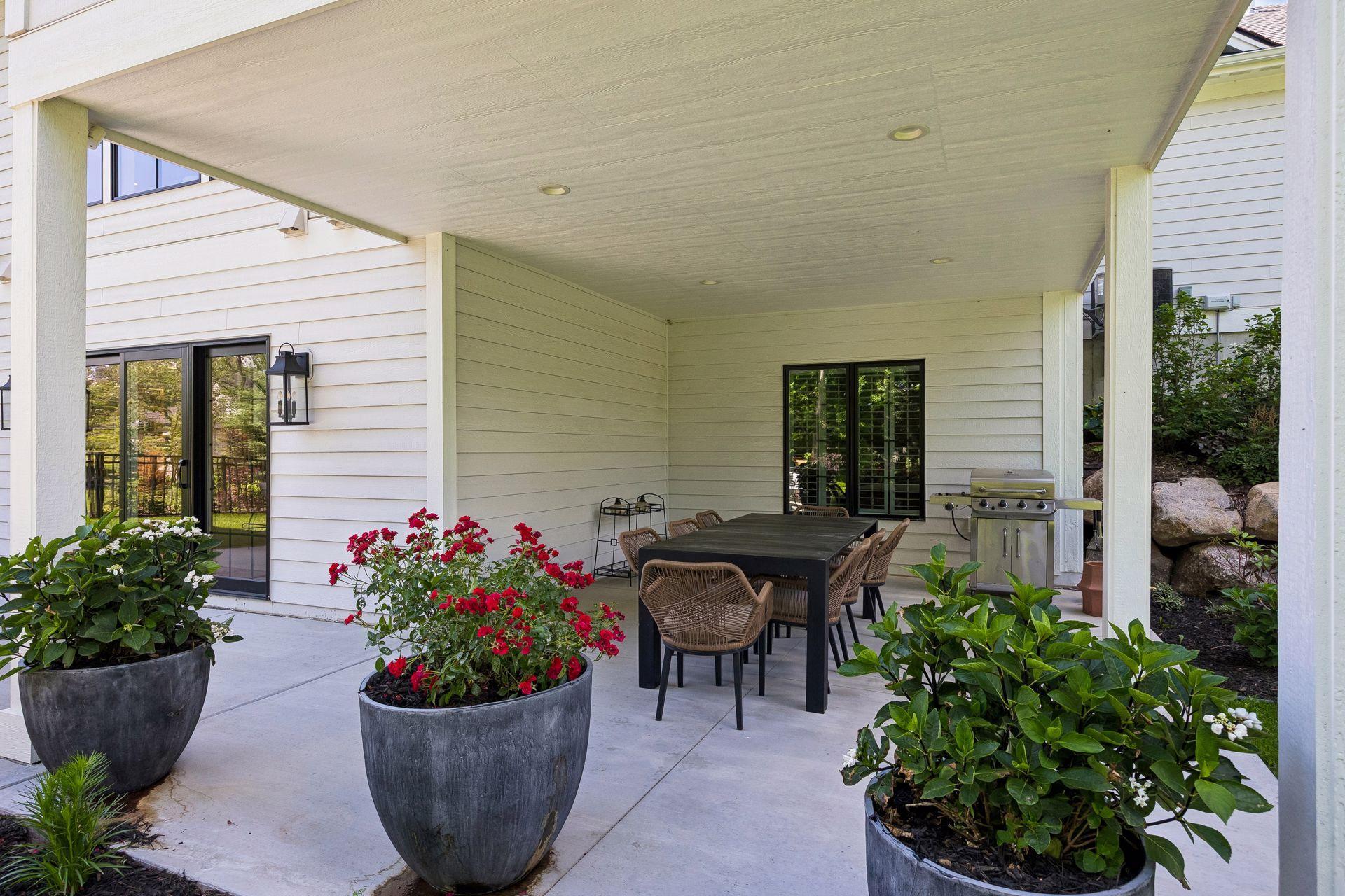 The covered patio extends your living space outdoors, providing the perfect setting for dining and entertaining in every season.