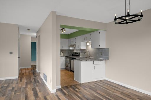 Open-concept dining area with seamless access to the kitchen, creating an ideal layout for everyday living and entertaining.