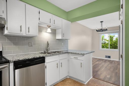 Designed for connection, the open-concept main level seamlessly blends the living, dining, and kitchen spaces.