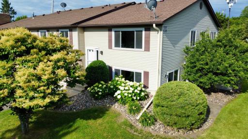 Attractive end-unit townhome surrounded by mature landscaping and open green space in a convenient Eden Prairie location.