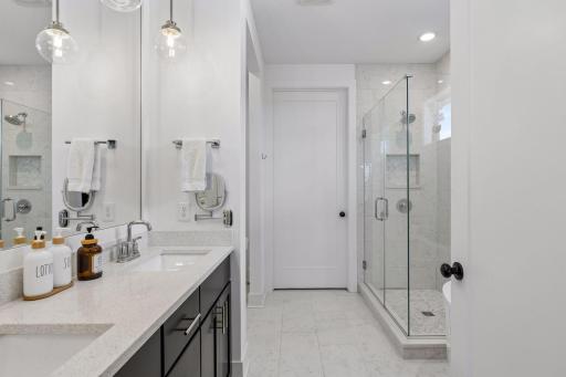 Owner's suite bathroom with double vanity & walk in shower.