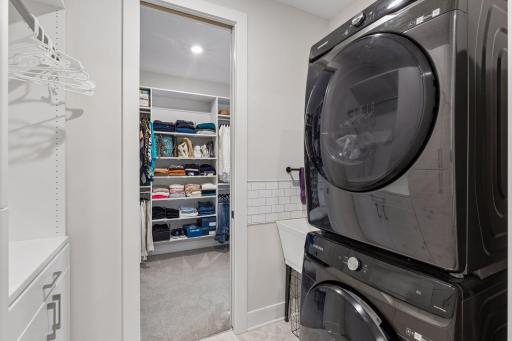 Laundry connected to owner's suite closet.