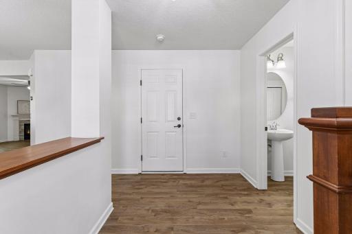 Fresh, bright entry with updated LVP flooring.