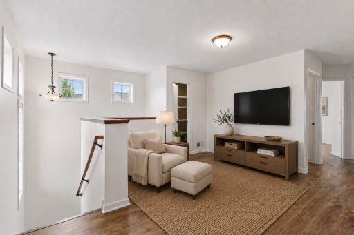 Upper level loft offers flexible living space. (Virtually staged.)