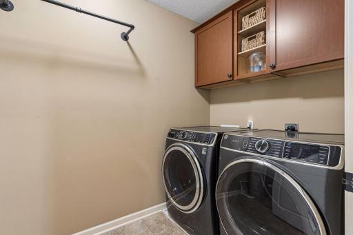 Convenient upper level laundry room with newer washer and dryer.