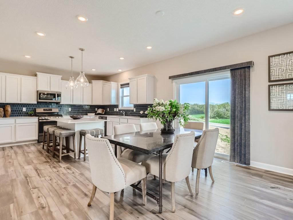 Photo is of the actual model. Located just off the kitchen is the elegant dinette!
