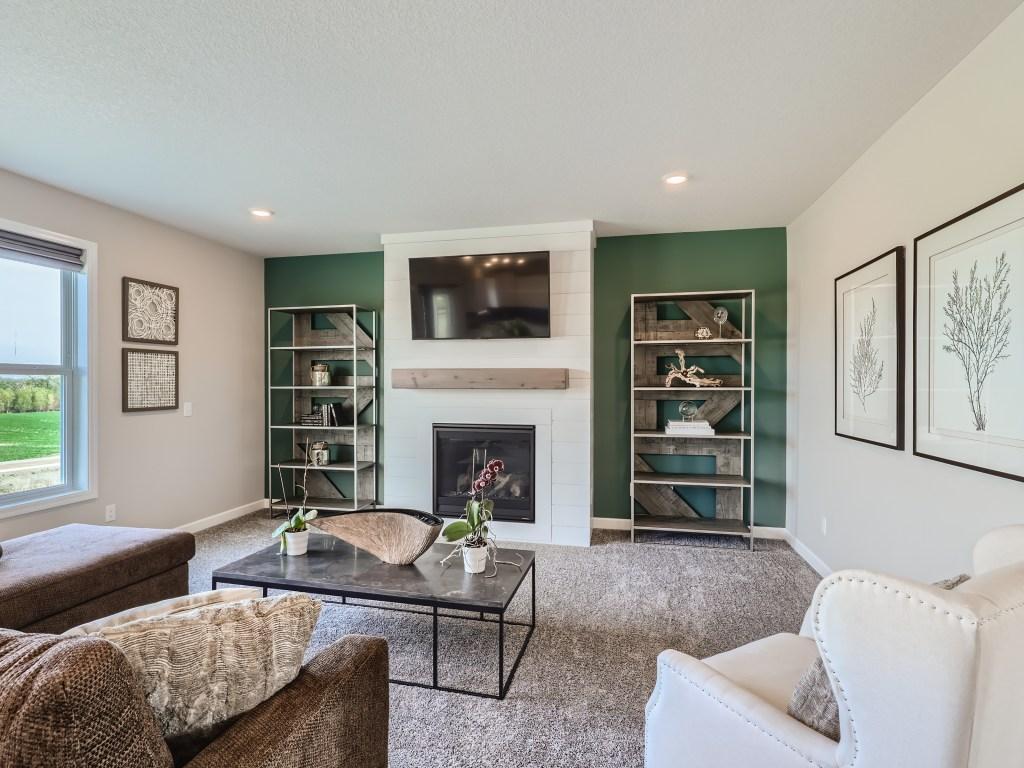 Photo is of the actual model. Comfortable spaces for the entire family in the nearly 2,700 square foot home!
