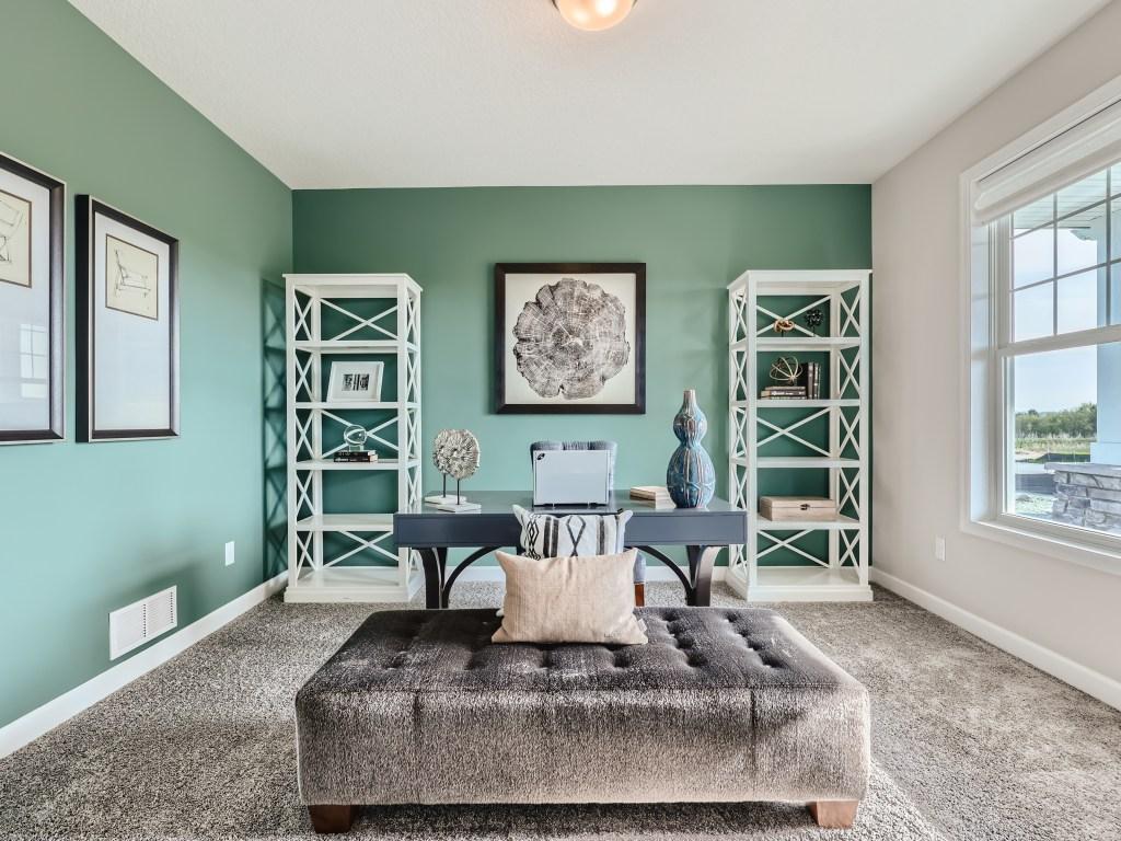 Photo is of the actual model. Main level office-flex space with double doors will give you that private space you need!