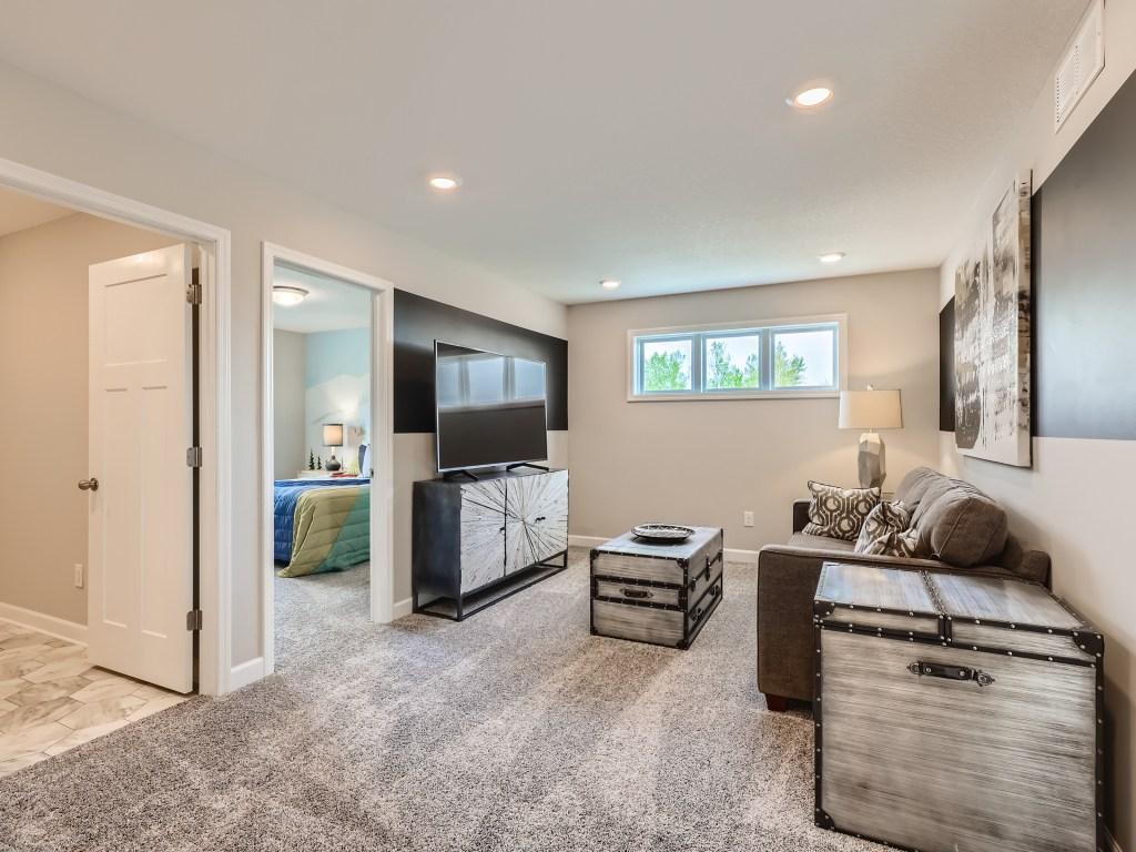 Photo is of the actual model. The upper level loft is a great space for the entire family!