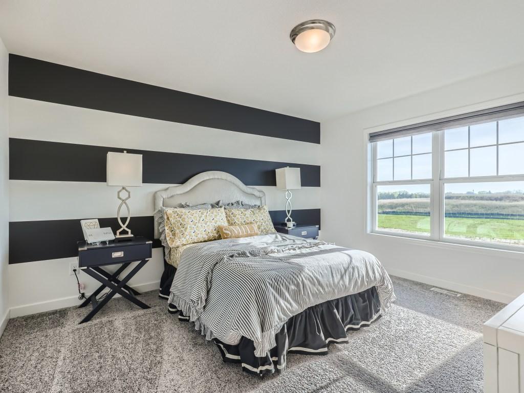 Photo is of the actual model. Very spacious upper level guest bedrooms and only steps away from the loft.