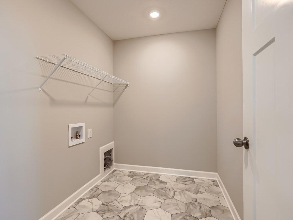 Photo is of the actual model. Enjoy upper level laundry!