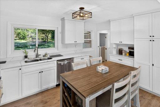 The spacious kitchen offers abundant cabinetry and effortless access to the backyard, making it ideal for entertaining indoors and out.