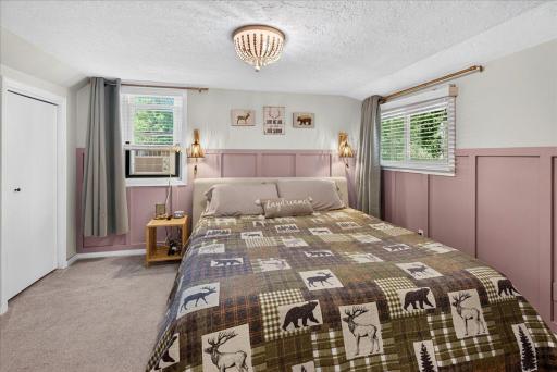 The generously sized primary bedroom offers excellent space and functionality, complete with dual closets for ample storage.