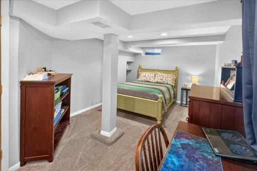 A generously sized third bedroom with neutral dÃ©cor, providing plenty of space for a desk, closet, and additional furnishings.