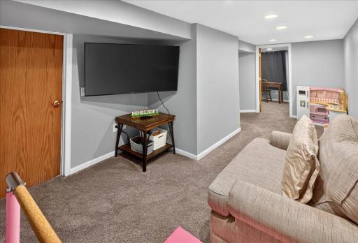 Spacious lower-level family roomâperfect for entertaining, hosting guests, or creating a comfortable retreat.