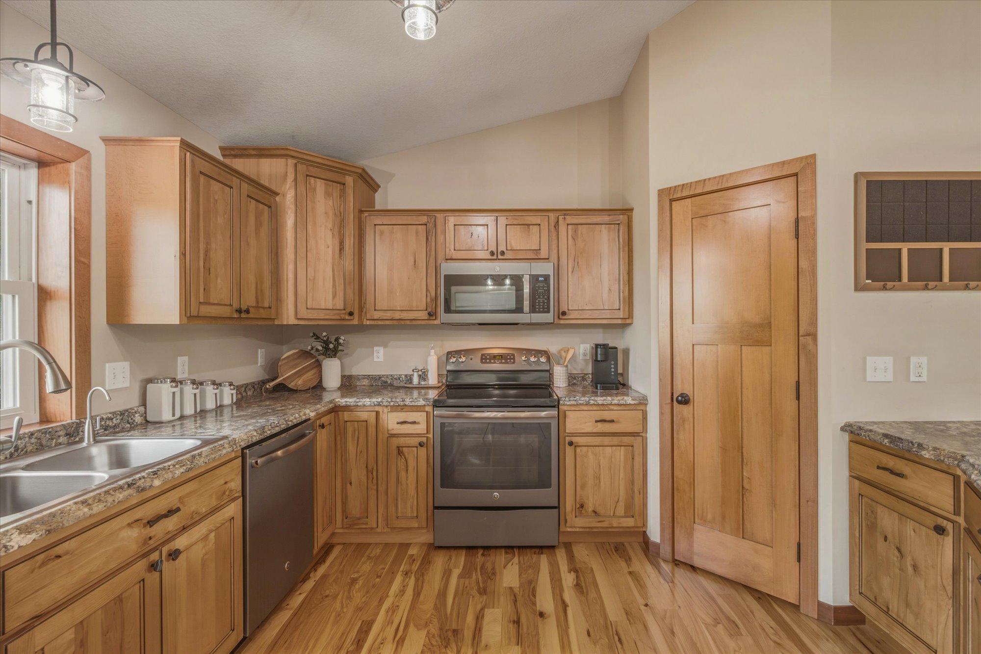 The abundant cabinetry includes a walk in pantry