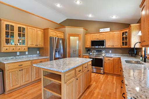 The lighted corner pantry offers tons of storage
