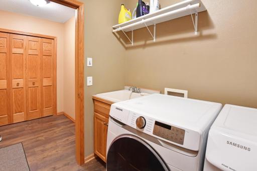 The closet in mud room area offers plenty of storage and drop space for book bags, shoes, and everything in between