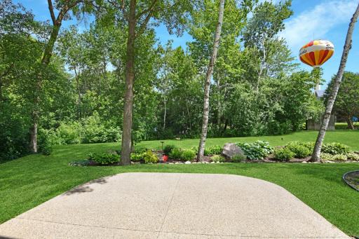 This back-yard is what dreams are made of. Imagine soaking in the wooded & landscaped privacy on a large exposed agg patio!