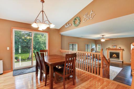 The dining leads to the patio and overlooks the cozy great room ~ enjoy entertaining, family time and conversation with this open concept layout
