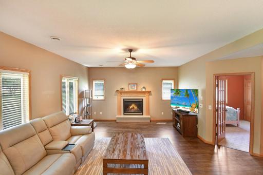 With one of 2 gas fireplaces as the focal point, this great room opens to a flex room which is currently host to a bedroom with large closet