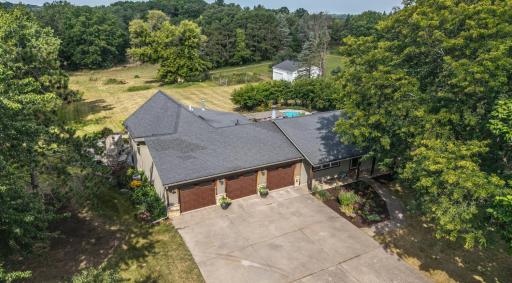 Escape to Your Private Nature Retreat in the Hills of Afton! Nestled on 5.42 picturesque acres, this 4-bedroom, 4-bath rambler!