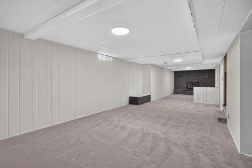Lower level: living area + bonus area for play room or exercise + bar room
