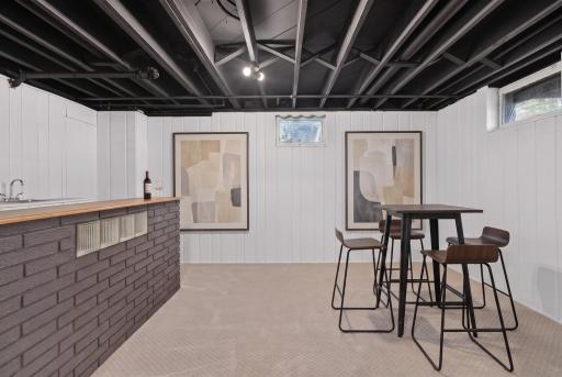 Lower level: room with bar (virtually staged)
