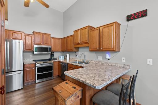 Countertop seating and open kitchen off of dining room