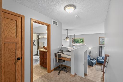 Upper level bathroom and built-in workspace