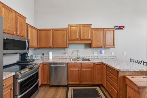 Spacious, open kitchen with large counters and SS appliances