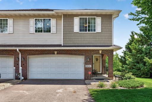 Two stall garage and front entry with brick archways
