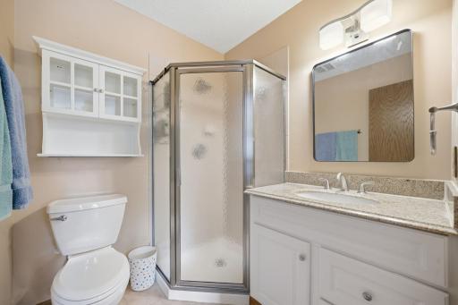 Upstairs, you'll find brand new carpet, an open and airy layout, and more beautiful windows that fill the space with natural light. This level includes two bedrooms, a full bathroom, and a spacious primary suite featuring a walk-in closet and private
