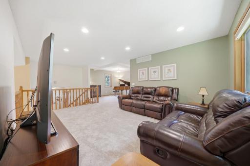 Upstairs, you'll find brand new carpet, an open and airy layout, and more beautiful windows that fill the space with natural light. This level includes two bedrooms, a full bathroom, and a spacious primary suite featuring a walk-in closet and private