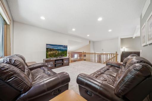 Upstairs, you'll find brand new carpet, an open and airy layout, and more beautiful windows that fill the space with natural light. This level includes two bedrooms, a full bathroom, and a spacious primary suite featuring a walk-in closet and private
