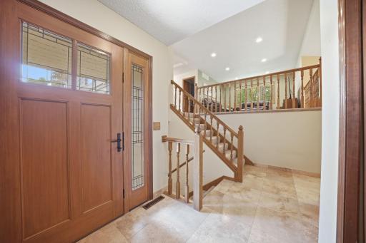 A large tiled entryway welcomes you into the home and provides a practical space for coats, shoes, backpacks, and all of life's daily comings and goings.