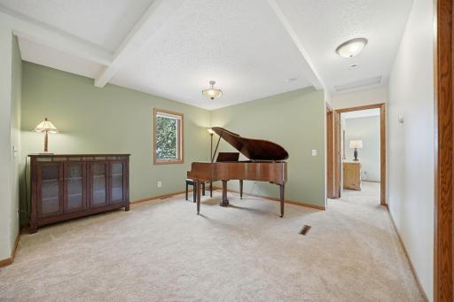 Upstairs, you'll find brand new carpet, an open and airy layout, and more beautiful windows that fill the space with natural light. This level includes two bedrooms, a full bathroom, and a spacious primary suite featuring a walk-in closet and private