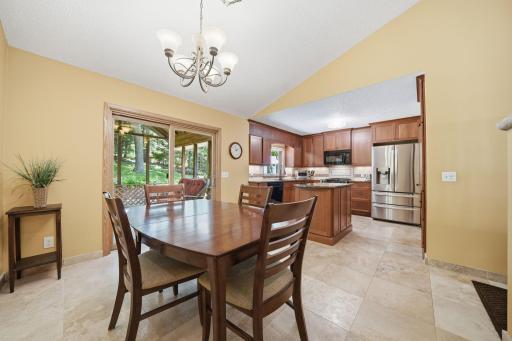Beautiful tile floors welcome you into the main level, where the updated kitchen features lovely cabinetry, granite countertops, and a stainless steel refrigerator that even makes round ice cubes :)