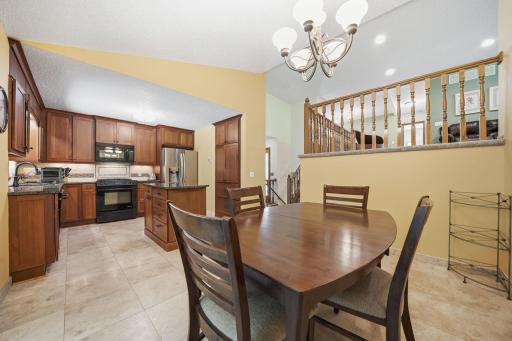 Beautiful tile floors welcome you into the main level, where the updated kitchen features lovely cabinetry, granite countertops, and a stainless steel refrigerator that even makes round ice cubes :)