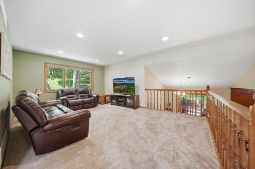 Upstairs, you'll find brand new carpet, an open and airy layout, and more beautiful windows that fill the space with natural light. This level includes two bedrooms, a full bathroom, and a spacious primary suite featuring a walk-in closet and private