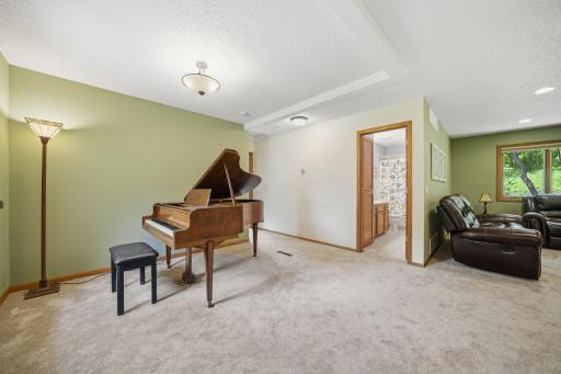 Upstairs, you'll find brand new carpet, an open and airy layout, and more beautiful windows that fill the space with natural light. This level includes two bedrooms, a full bathroom, and a spacious primary suite featuring a walk-in closet and private